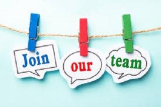 "Join" , "Our" and "Team" pinned to clothes line with clothes pins.