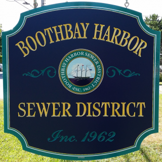 Boothbay Harbor Sewer District sign at side of road